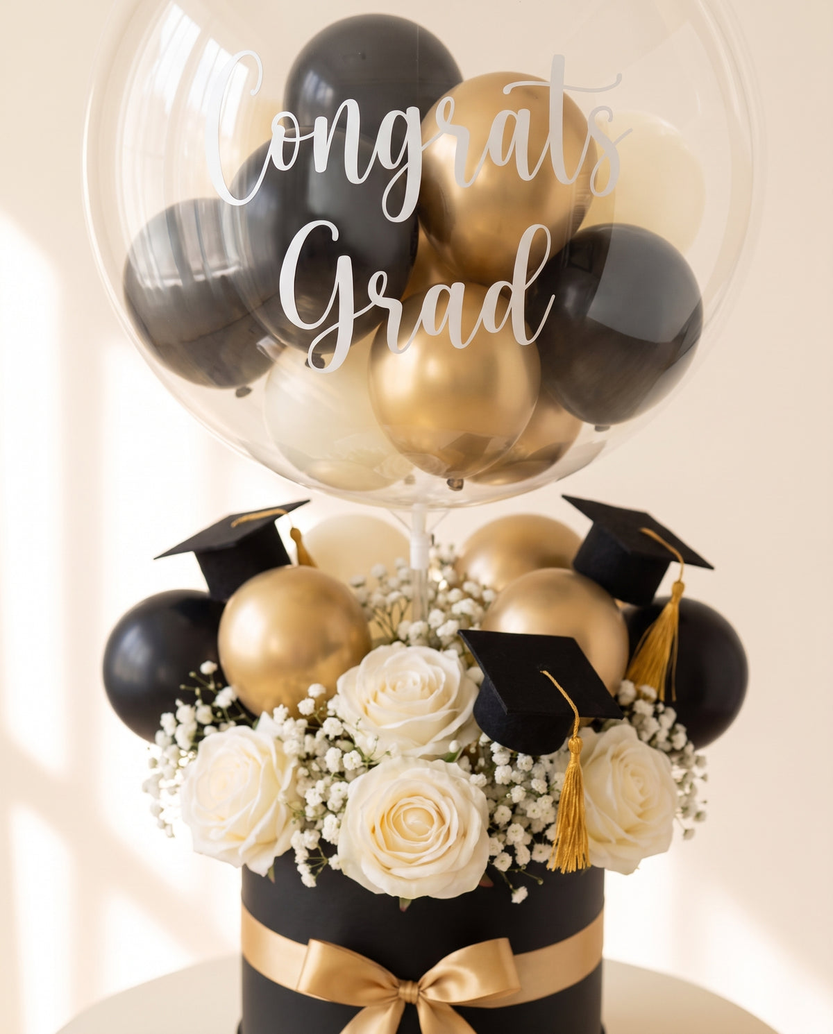 Close-up of the Congrats Grad lettering on the bubble, the mini balloons and the flowers (design concept)